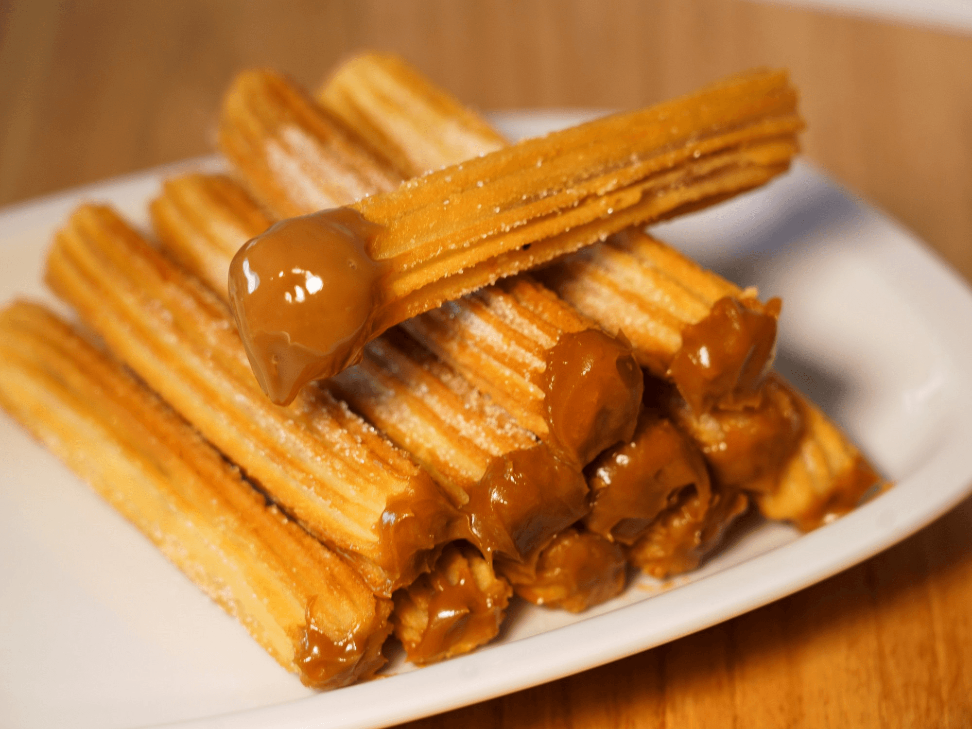 Freshly fried churros with dulce de leche